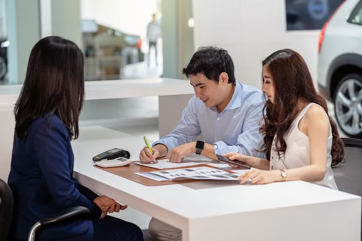 asian couple signing contract with saleswoman after decision buy new car showroom 41418 4503
