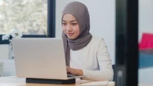 Beautiful Asian Muslim Lady Casual Wear Working Using Laptop Modern New Normal Office