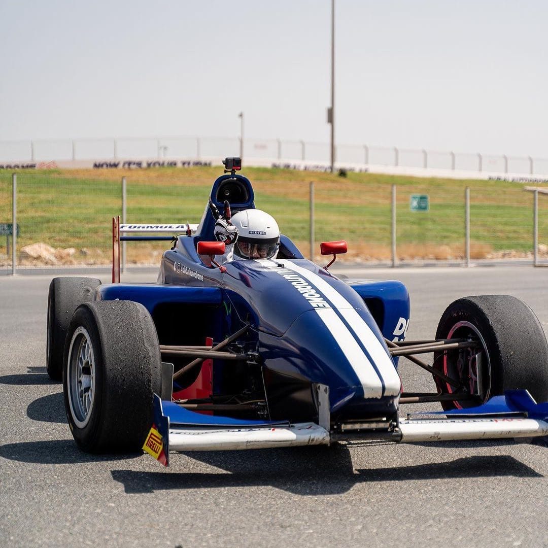 PickATripDubai Dubai Autodrome F1 pose