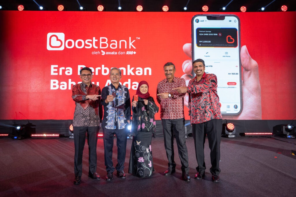 Group shot of the Boost Bank team with the upcoming debit card