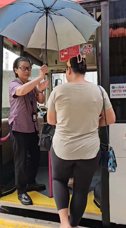 Kind Bus Driver With Umbrella In Singapore 3