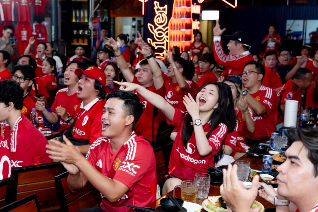 Machester United Fans Erupt In Cheers At A Live Match Viewing Party