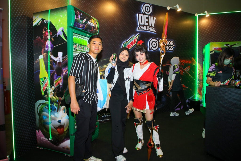 From Left A Couple Posing Next To A Yun Ying Cosplayer