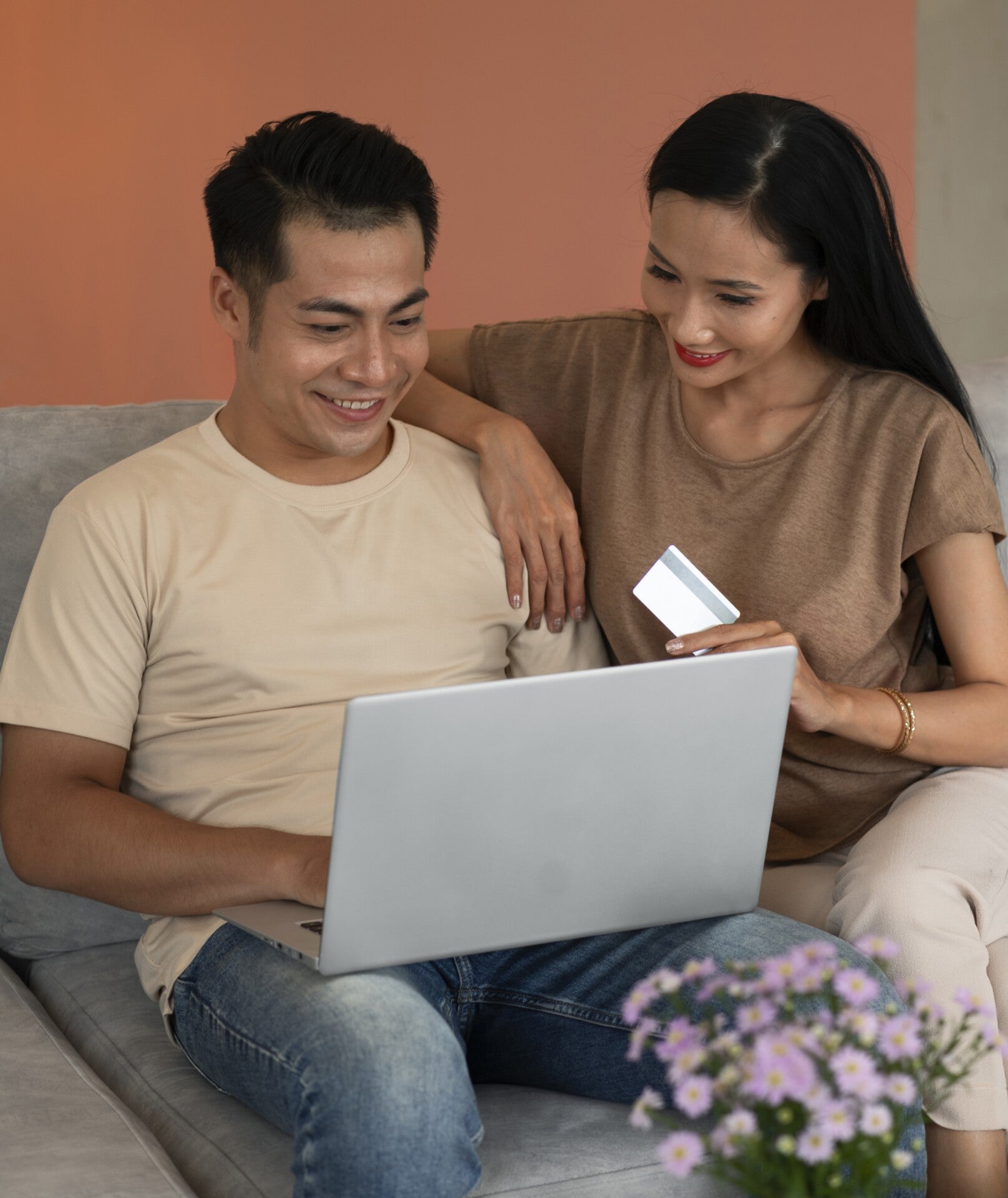 Affectionate Couple Home Working Laptop While Sitting Sofa 1