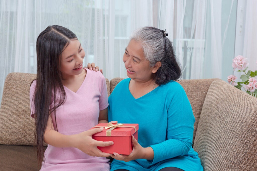 beautiful young women give gifts mothers