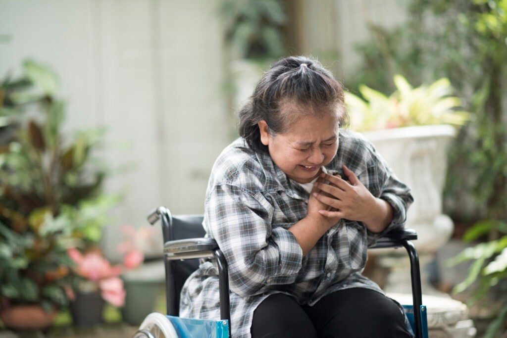 elderly woman have heart disease sitting wheelchair