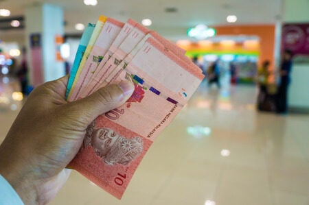 108338765 malaysia money ringgit bill in hand ready for shopping