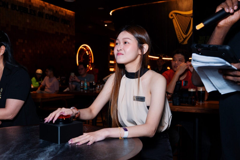 Chief Pint Officer CPO finalist Voon Fanny testing her knowledge in the Guinness themed buzzer trivia challenge