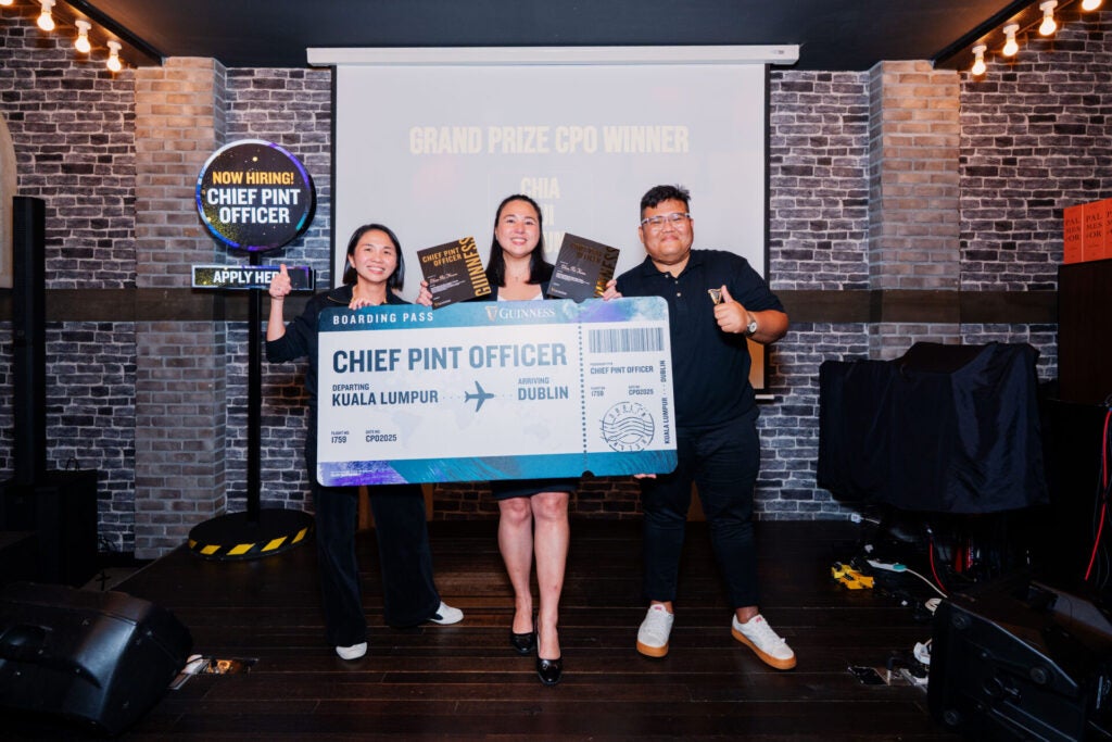 The newly crowned Grand Guinness Chief Pint Officer CPO Chia Pui Kwun proudly holding her ticket to Dublin Ireland