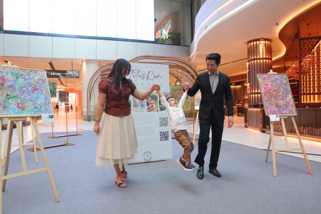 Titus Ren And His Parents Happily Exploring A New Dawn Exhibition At L1 Indoor Plaza