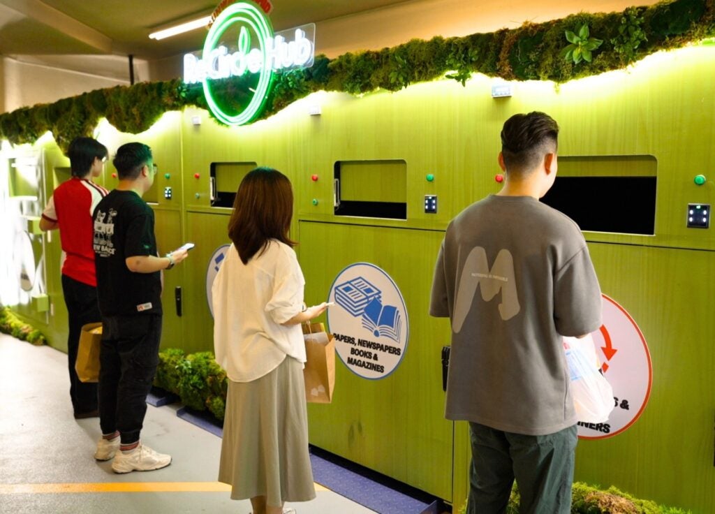 Sunway Pyramid Shopper Awaiting For The Compartment To Open And Deposit